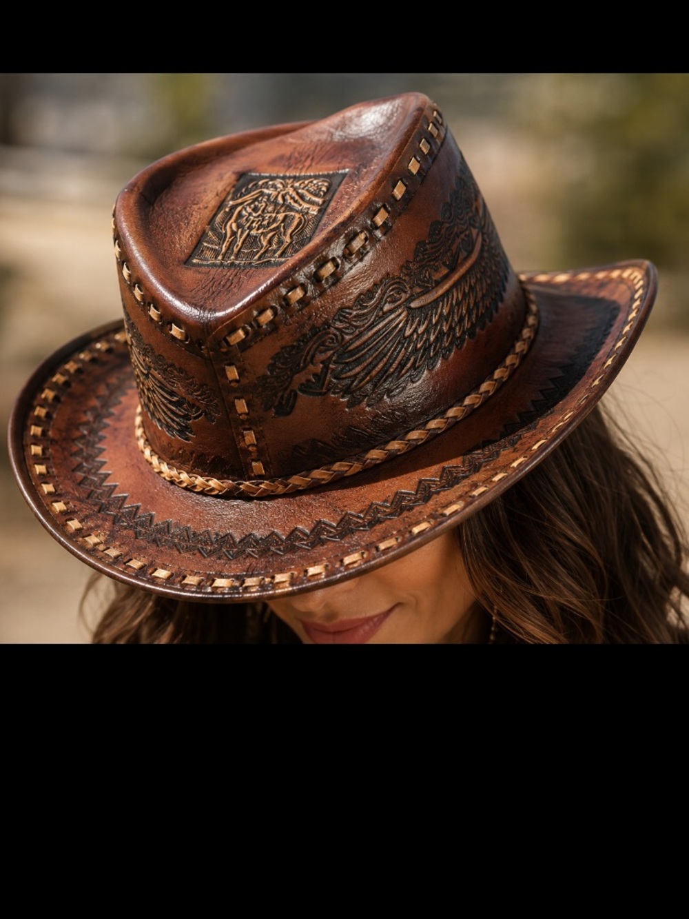 Brown Leather Cowboy Hat with Wide Brim and Decorative Band